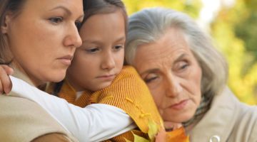 three generation women mourning