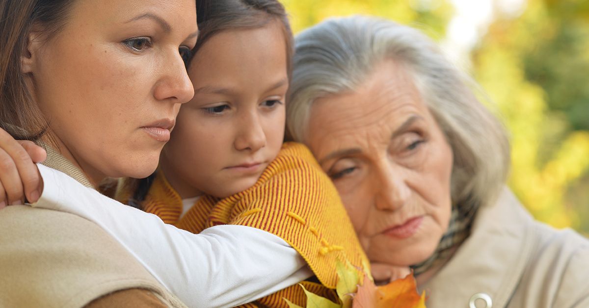 three generation women mourning